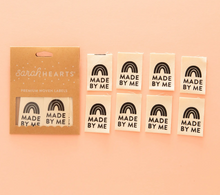 Load image into Gallery viewer, Woven center fold label by Sarah Hearts cream white background with black rainbow and black lettering Made by Me for clothing garments purses zippy bags quilts and sewing projects organic cotton