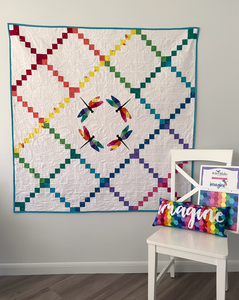 Dragonfly Flight Quilt Pattern by Kristy Lea aka Quiet Play modern Irish chain variation with a circle of geometric rainbow dragonflies in the center skill level intermediate
