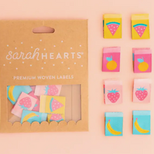 Load image into Gallery viewer, Sarah Hearts Summer Fruits woven double sided labels for garments clothing bags quilts multi-colored backgrounds of yellow pink aqua with watermelon slice strawberry banana and orange
