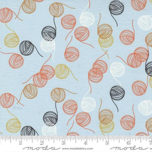 sky blue background with orange gold black white and brown yarn balls skeins scattered Lazy Afternoon by Zen Chic for Moda Fabrics quilt weight cotton quilting garments clothing projects 