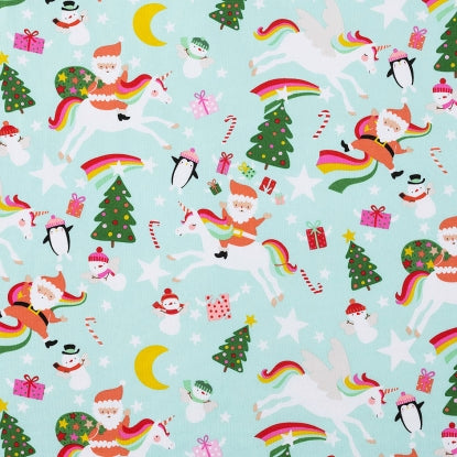 Yuletice Unicorn on pale aqua by Alexander Henry Fabrics Santa riding a unicorn with a rainbow tail Christmas trees presents moon stars and snowmen great for stockings quilts tree skirt and sewing projects 