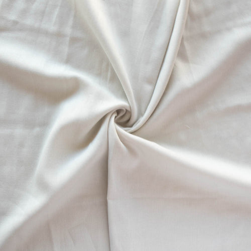 Organic cotton double gauze by Birch Fabrics in the color Moonlit a soft cream white perfect for a baby blanket swaddle or garments tank top blouse skirt