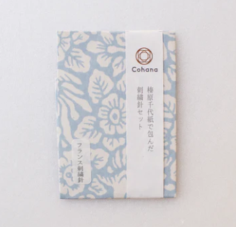 Embroidery Needle Pack Set Cohana Made in Hiroshima Japan  packaging by Hibara washi in Tokyo set of sharp needles for embroidery in beautiful package with soft blue background and imprinted white flowers Cohana japanese  character labels