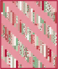 Load image into Gallery viewer, Luna Quilt pattern in Holly Jolly fabrics with pink background by Erica Jackman Kitchen Table Quilting Designs for quiltalong QAL SAL
