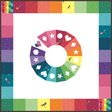 Load image into Gallery viewer, Daydream quilt pattern by Kristy Lea aka Quiet Play Foundation Paper Pieced color wheel center in rainbow fabrics with stars hearts diamonds hexie geometric shapes and rainbow checkerboard pattern Riley Blake Designs skill level intermediate
