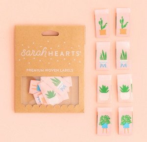 Woven labels by Sarah Hearts with bright green succulents and houseplants in modern blue white and terra cotta containers centerfold double sided design soft and machine washable for use in garments quilts clothing purses bags and sewing projects 