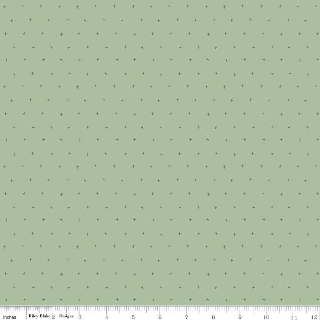 Roar by Citrus + Mint for Riley Blake Designs light sage green background with darker green scattered small plus signs cotton fabric for quilts bags clothing garments