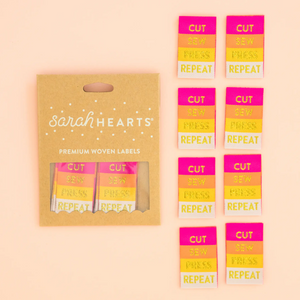 Sarah Heart double fold premium labels for quilts garments clothing bags sewing projects Cut Sew Press Repeat in gold letters on hot pink orange yellow white 