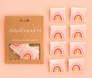 Sarah Hearts woven double fold labels for quilts garments clothing bags sewing projects  Made During Naptime in dusty rose pink curved over a rainbow on a blush pink background