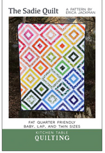 Load image into Gallery viewer, The Sadie Quilt pattern by Erica Jackman Kitchen Table Quilting multiple sizes baby throw twin queen king colorful square frames surrounding a solid center square intermediate skill level traditional piecing

