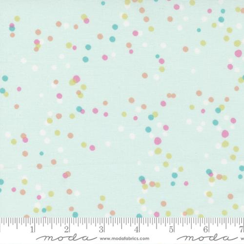 Multicolored dots on a soft mint background. 