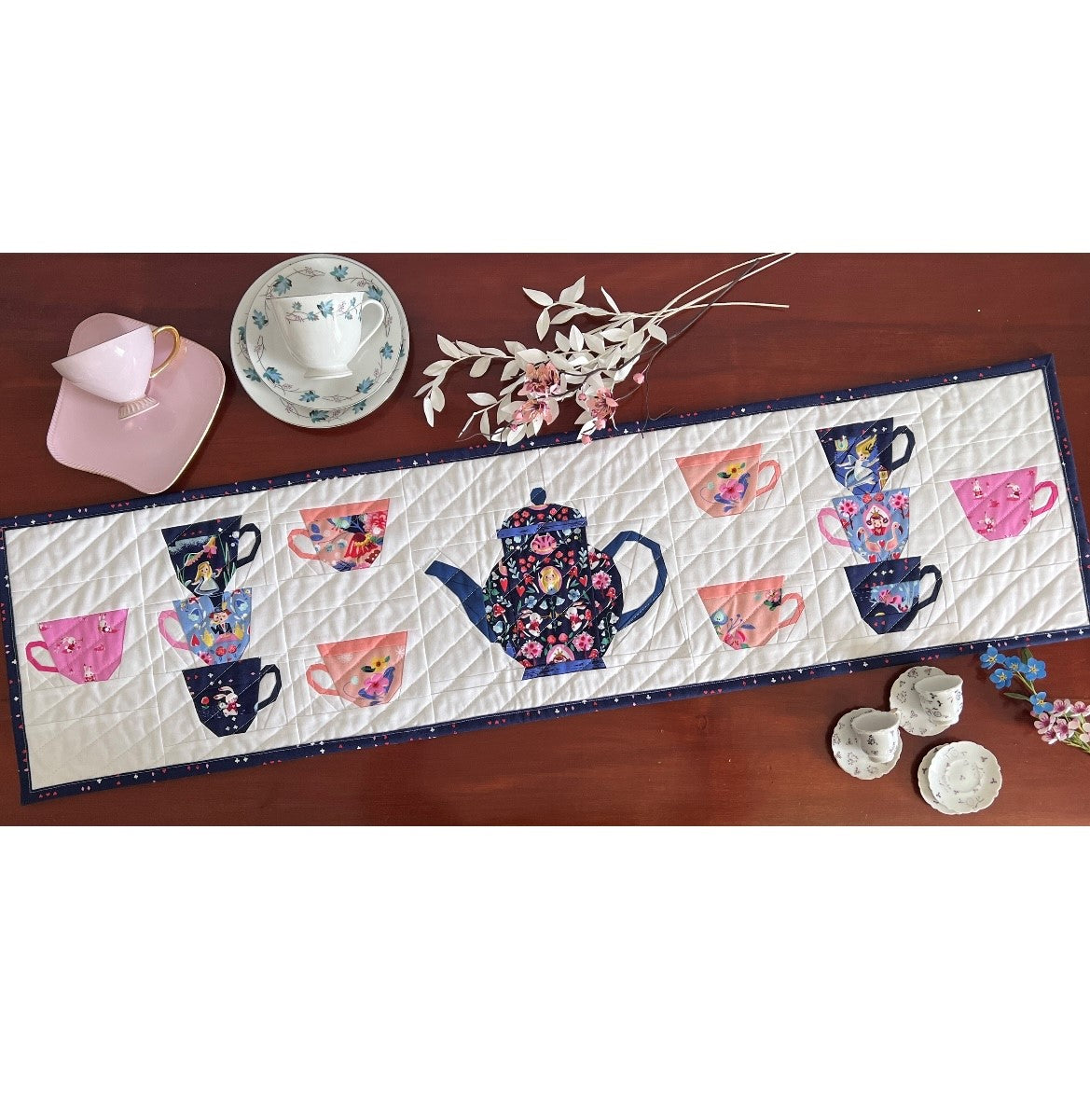 Quiet Play Tea Party table runner kit using Down the Rabbit Hole fabric by Jill Howarth for Riley Blake Designs Alice in Wonderland theme teapot teacups 